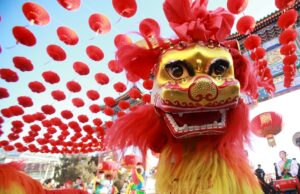 Traditional dancers perform the lion dance during the opening ceremony of a temple fair in Ditan Park at the beginning of Chinese Lunar New Year in Beijing