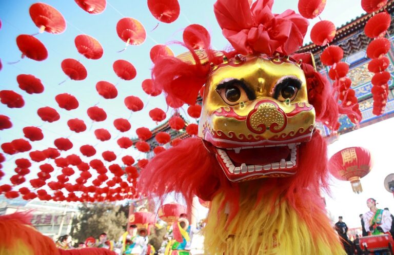 Traditional dancers perform the lion dance during the opening ceremony of a temple fair in Ditan Park at the beginning of Chinese Lunar New Year in Beijing